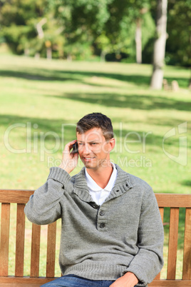 Man phoning on the bench
