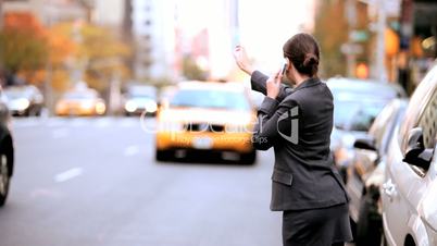 Businesswoman Hailing a Cab