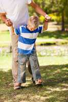 Father playing with his son  in the park