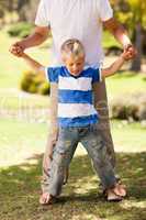 Father playing with his son  in the park