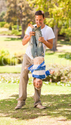 Father playing with his son  in the park