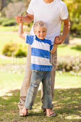 Father playing with his son  in the park