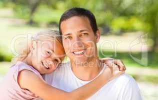 Father with her daughter in the park