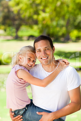 Father with her daughter in the park