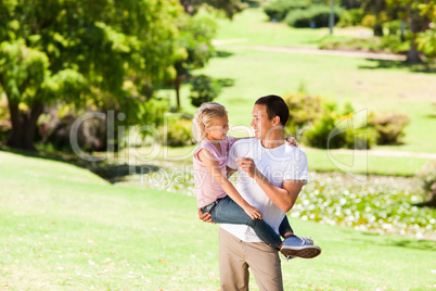 Father with her daughter in the park