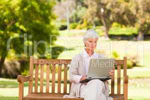 Retired woman working on her laptop