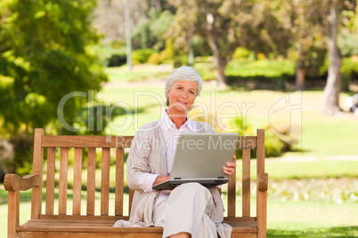 Retired woman working on her laptop