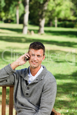 Man phoning on the bench