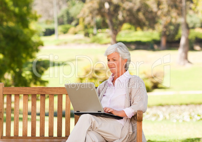 Retired woman working on her laptop