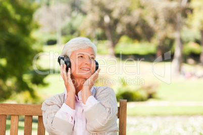 Senior woman listening to some music