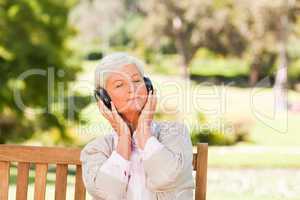 Senior woman listening to some music