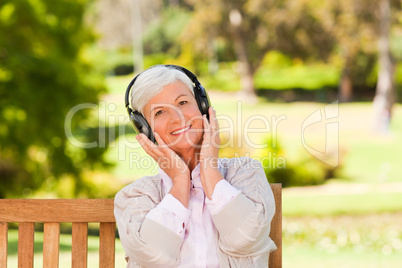 Senior woman listening to some music