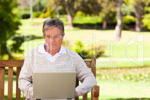 Senior man working on his laptop