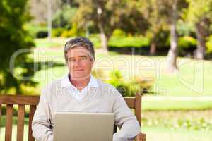 Senior man working on his laptop