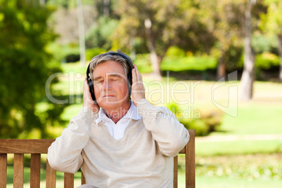 Retired man listening to some music