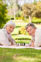 Retired couple playing chess