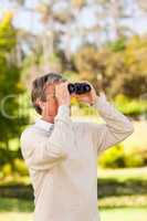 Mature man birds watching