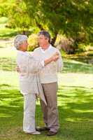 Senior couple dancing in the park