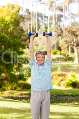 Mature man doing his exercises in the park