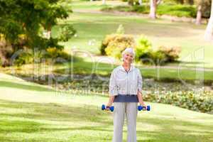Mature woman doing her exercises in the park