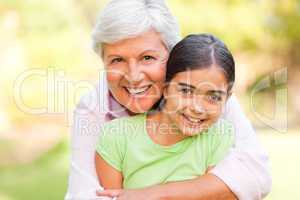Grandmother hugging her granddaughter