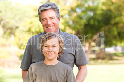 Grandfather with his grandson in the park