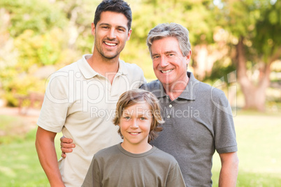 Family looking at the camera in the park