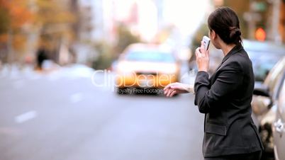 Young Businesswoman Hailing a Cab