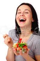 Young attractive woman eats vegetable salad