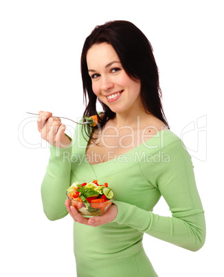 Young attractive woman eats vegetable salad