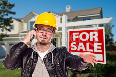 Contractor in Hard Hat in Front of House and Sign