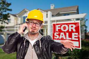 Contractor in Hard Hat in Front of House and Sign