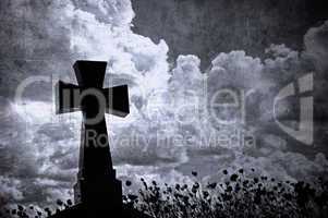 Grunge image of a cross in the cemetery, perfect halloween backg