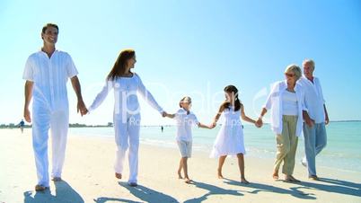 Three Generations of Family Walking on the Beach