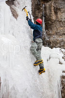 Man with ice axes and crampons