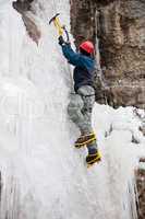 Man with ice axes and crampons