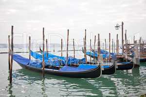 Gondolas with blue cover in Venice