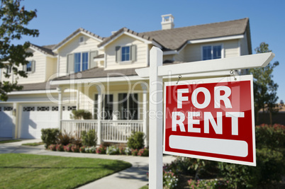 For Rent Real Estate Sign in Front of House