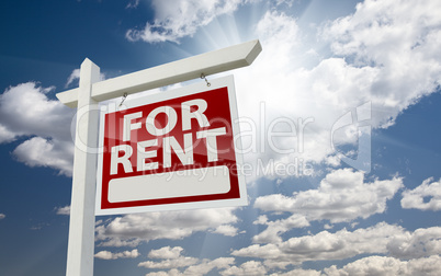 Right Facing For Rent Real Estate Sign Over Sunny Sky