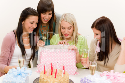 Birthday party - woman unwrap present, celebrating