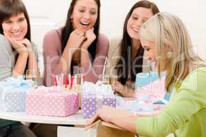 Birthday party - woman unwrap present, celebrating