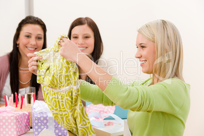 Birthday party - woman unwrap present, surprise