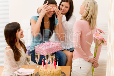 Birthday party - woman getting present and flower