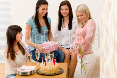 Birthday party - woman getting present and flower