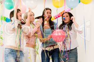 Birthday party celebration - four woman with confetti