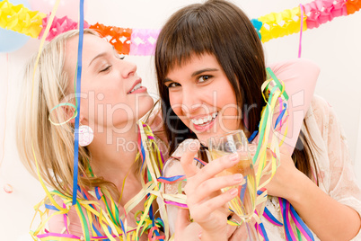 Birthday party celebration - two woman with confetti have fun