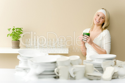 Modern kitchen - happy woman washing dishes