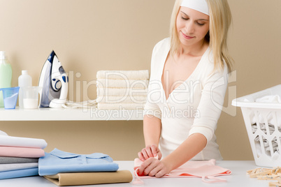 Laundry ironing - woman folding clothes