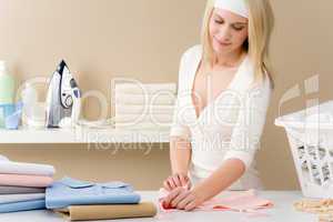 Laundry ironing - woman folding clothes