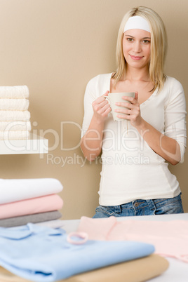 Laundry ironing - woman coffee break